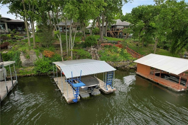 611 N Winnebago Dr, Lake Winnebago, MO 64034 - dock featuring boat lift and a water view