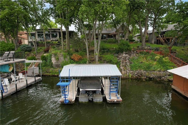 611 N Winnebago Dr, Lake Winnebago, MO 64034 - dock with boat lift and a water view