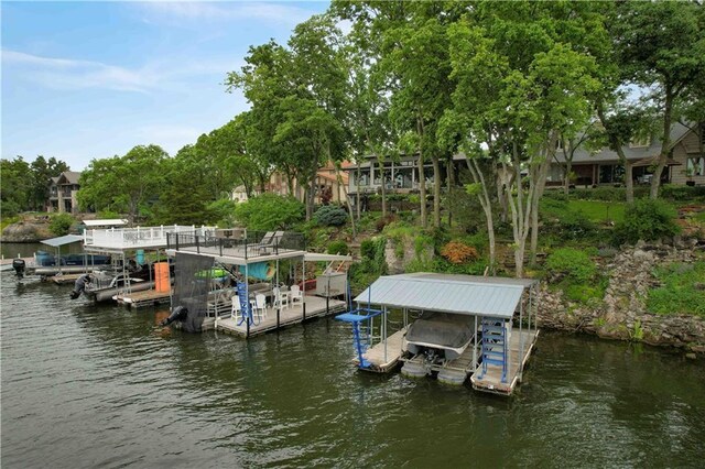 611 N Winnebago Dr, Lake Winnebago, MO 64034 - dock with boat lift and a water view
