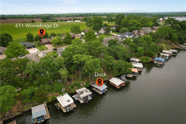 611 N Winnebago Dr, Lake Winnebago, MO 64034 - aerial view of a nearby body of water and a tree filled landscape