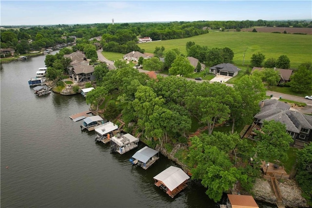 611 N Winnebago Dr, Lake Winnebago, MO 64034 - drone / aerial view of a nearby body of water and a tree filled landscape