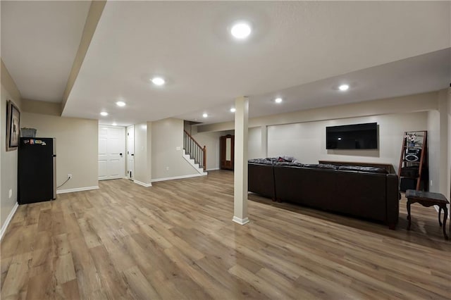 611 N Winnebago Dr, Lake Winnebago, MO 64034 - living room featuring recessed lighting, baseboards, light wood-style floors, and stairway