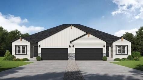 1216 SE Windbreak Dr, Lees Summit, MO 64081 - view of front facade featuring an attached garage, board and batten siding, driveway, and a front lawn