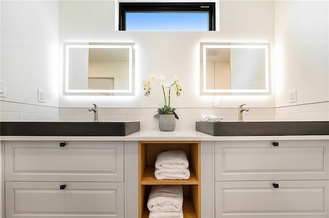 bathroom featuring double vanity and decorative backsplash