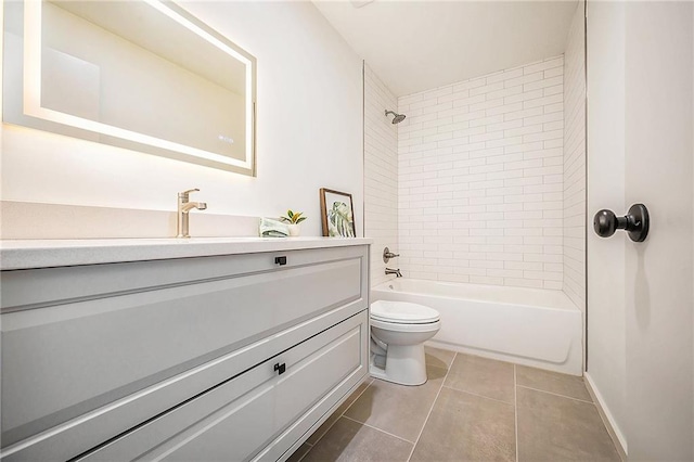 full bathroom with toilet, vanity, tile patterned floors,  shower combination, and baseboards