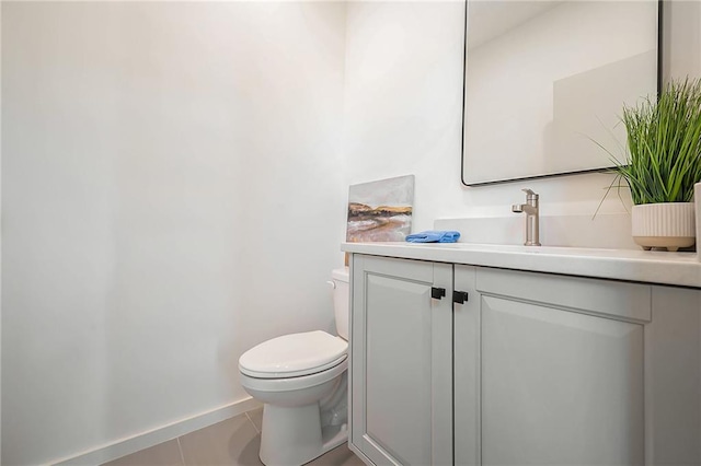 2605 W Paseo Blvd, Kansas City, MO 64108 - bathroom featuring vanity, toilet, tile patterned floors, and baseboards