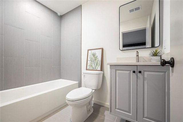 2605 W Paseo Blvd, Kansas City, MO 64108 - bathroom with toilet, tile patterned flooring, vanity, baseboards, and shower / bath combination