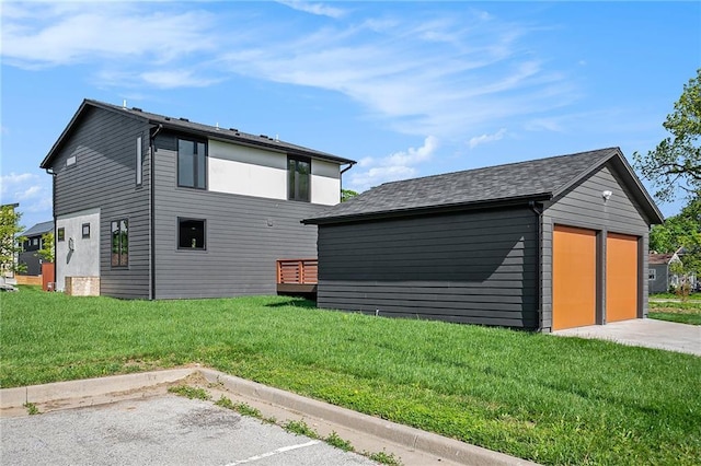 2605 W Paseo Blvd, Kansas City, MO 64108 - view of home's exterior with an outbuilding and a yard