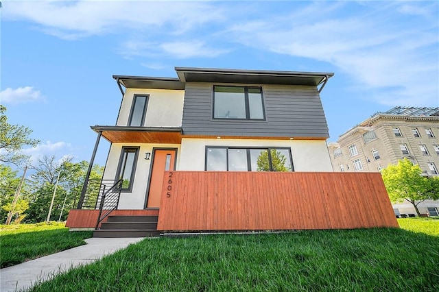 2605 W Paseo Blvd, Kansas City, MO 64108 - contemporary home featuring stucco siding and a front yard