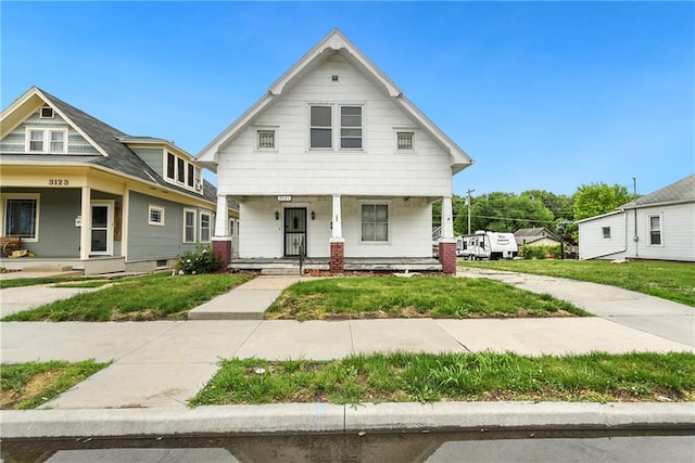 3121 Saint Joseph Ave, Saint Joseph, MO 64505 - view of front of property featuring a porch and a front lawn
