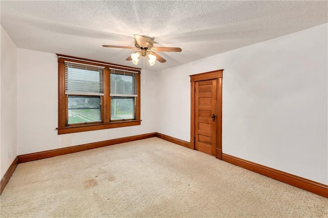 3121 Saint Joseph Ave, Saint Joseph, MO 64505 - spare room with carpet flooring, baseboards, ceiling fan, and a textured ceiling