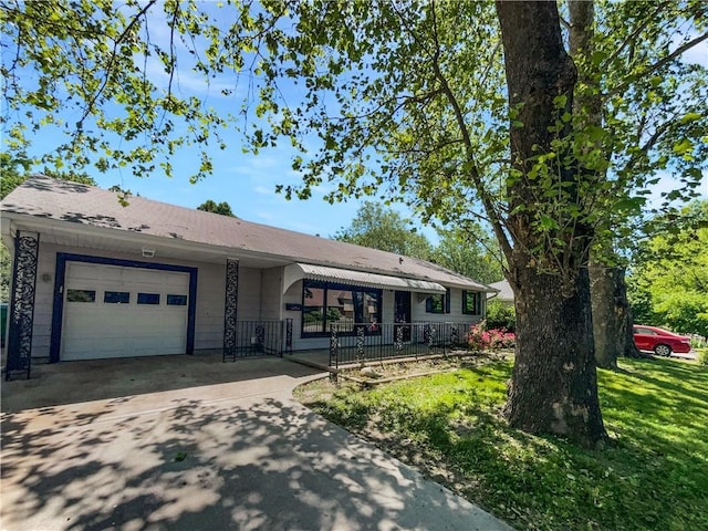 7139 Hardy St, Overland Park, KS 66204 - ranch-style house with a garage, driveway, and a front yard