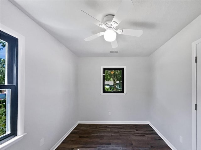 7139 Hardy St, Overland Park, KS 66204 - spare room with dark wood-type flooring, baseboards, and a ceiling fan