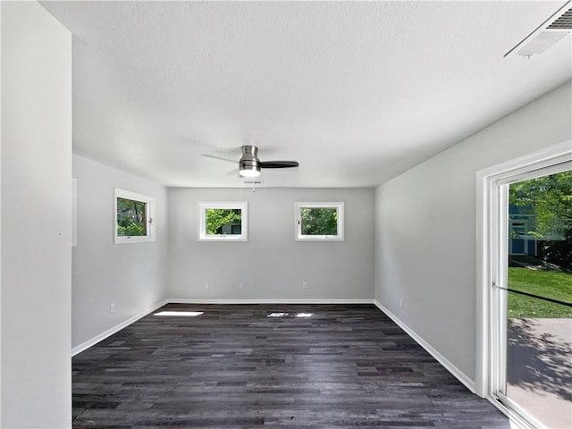 7139 Hardy St, Overland Park, KS 66204 - unfurnished room featuring ceiling fan, dark wood-type flooring, and baseboards