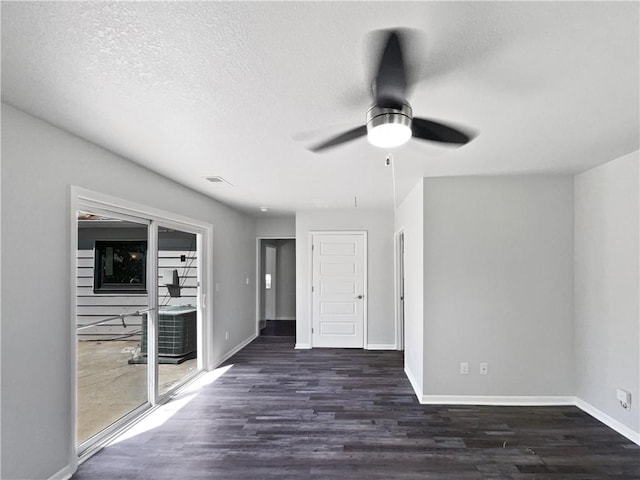 7139 Hardy St, Overland Park, KS 66204 - unfurnished room with a ceiling fan, wood finished floors, baseboards, and a textured ceiling