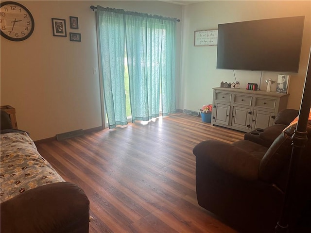 1300 S Main St, Harrisonville, MO 64701 - living room featuring wood finished floors and baseboards