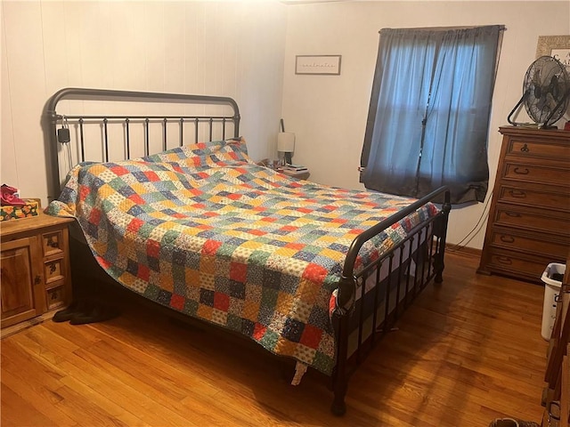 1300 S Main St, Harrisonville, MO 64701 - bedroom featuring wood finished floors
