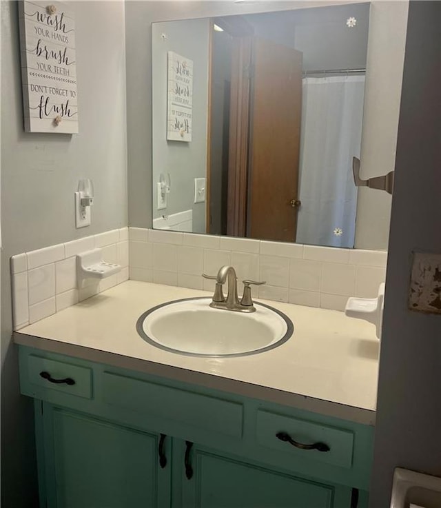 1300 S Main St, Harrisonville, MO 64701 - bathroom with vanity and tasteful backsplash