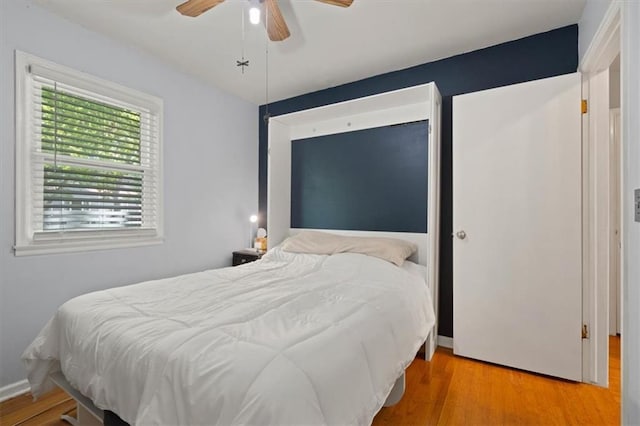 9520 Lamar Ave, Overland Park, KS 66207 - bedroom with wood finished floors and ceiling fan