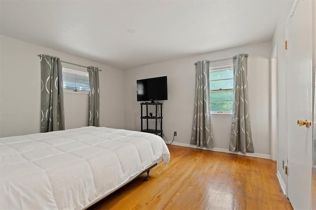 9520 Lamar Ave, Overland Park, KS 66207 - bedroom featuring wood finished floors and baseboards