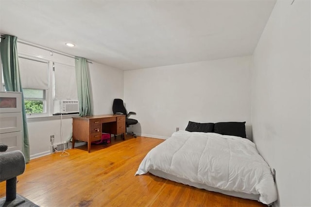 9520 Lamar Ave, Overland Park, KS 66207 - bedroom featuring wood finished floors, cooling unit, and recessed lighting