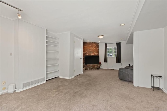9520 Lamar Ave, Overland Park, KS 66207 - unfurnished living room featuring carpet flooring, a brick fireplace, and recessed lighting