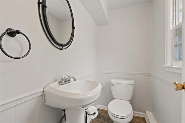 9520 Lamar Ave, Overland Park, KS 66207 - half bath featuring a wainscoted wall and toilet
