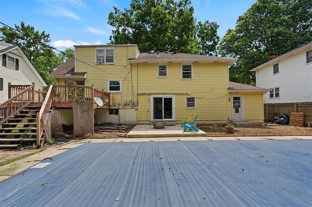 9520 Lamar Ave, Overland Park, KS 66207 - rear view of property featuring stairs, a deck, and a patio