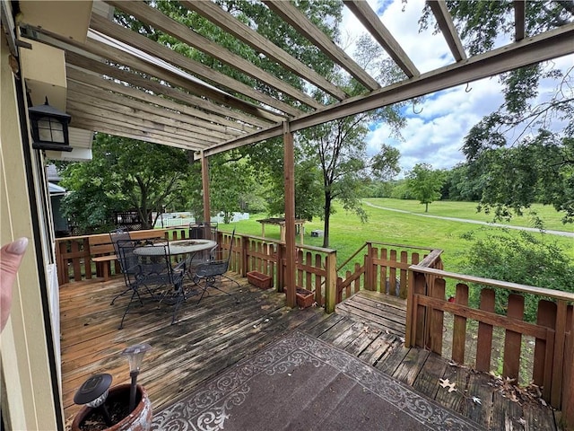 6705 E 140th Pl, Grandview, MO 64030 - deck with outdoor dining space, a yard, and view of scattered trees