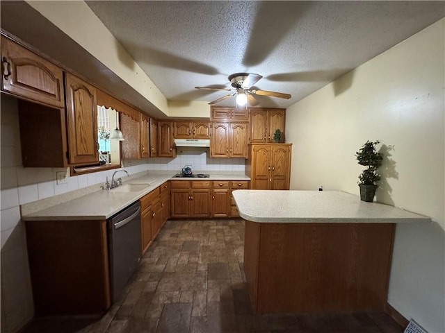 6705 E 140th Pl, Grandview, MO 64030 - kitchen with a sink, dishwasher, under cabinet range hood, a peninsula, and light countertops