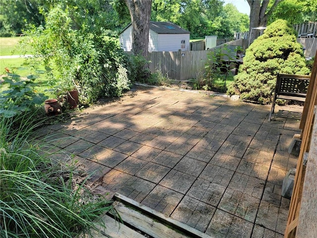 6705 E 140th Pl, Grandview, MO 64030 - wooden deck featuring a patio