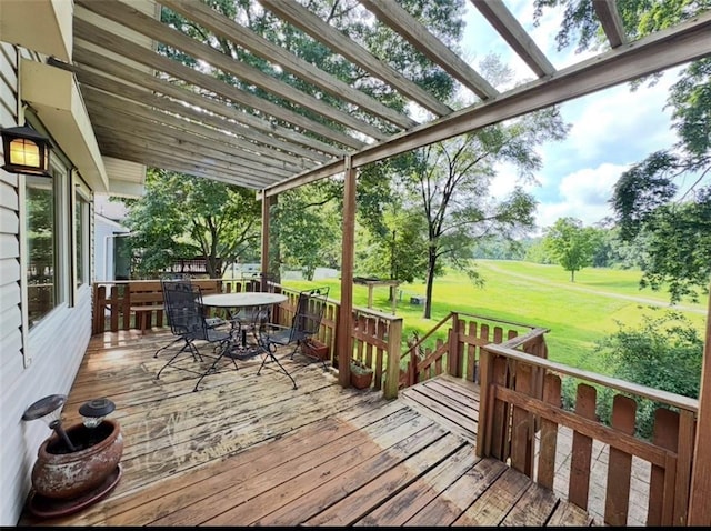 6705 E 140th Pl, Grandview, MO 64030 - wooden deck featuring outdoor dining space and a yard