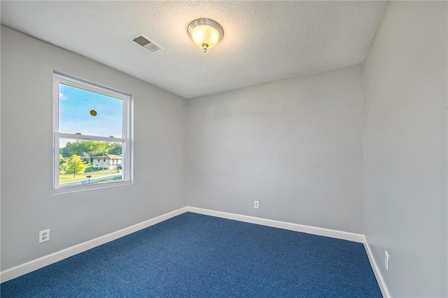 7175 Lingley Dr, Kansas City, MO 64152 - unfurnished room with a textured ceiling, baseboards, and dark carpet