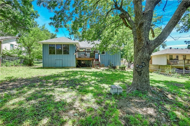 7608 N Serene Ave, Kansas City, MO 64152 - view of yard featuring a wooden deck and stairway
