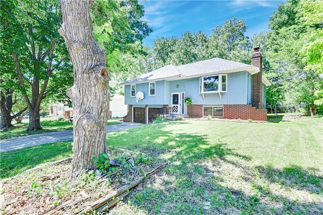 7608 N Serene Ave, Kansas City, MO 64152 - bi-level home with a chimney, a garage, a front yard, asphalt driveway, and brick siding
