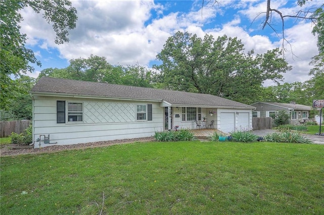 4838 Dearborn St, Mission, KS 66202 - ranch-style home featuring a garage and driveway