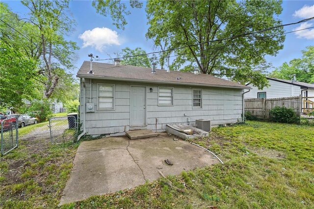 5609 E 101st St, Kansas City, MO 64137 - back of house with a patio area and central AC unit