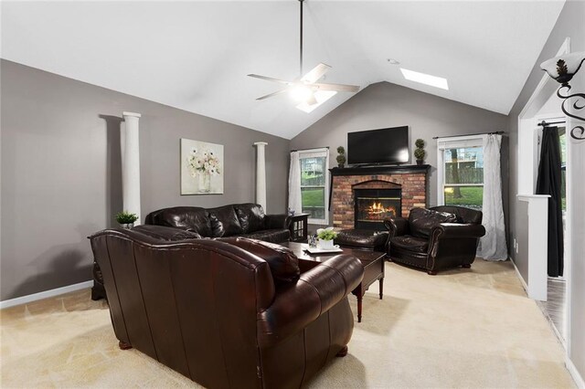 1512 Auburn Dr, Lees Summit, MO 64086 - living area with light carpet, lofted ceiling, ceiling fan, a fireplace, and baseboards