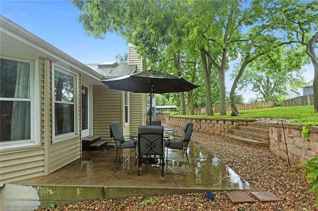 1512 Auburn Dr, Lees Summit, MO 64086 - fenced backyard with a patio area, entry steps, and outdoor dining space