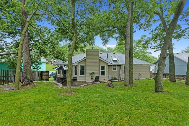 1512 Auburn Dr, Lees Summit, MO 64086 - back of property featuring a patio and a chimney
