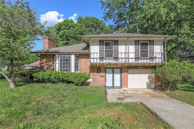 3601 S Hocker Ave, Independence, MO 64055 - split level home with a garage, a balcony, concrete driveway, brick siding, and a chimney