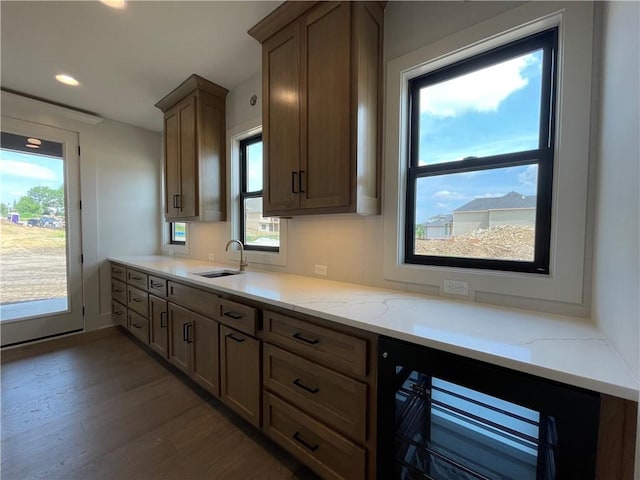 17000 Rosehill St, Overland Park, KS 66221 - kitchen featuring wine cooler, wood finished floors, plenty of natural light, light stone counters, and recessed lighting
