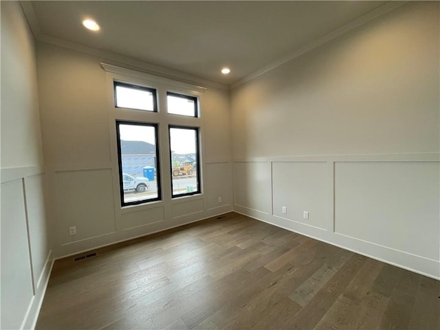 17000 Rosehill St, Overland Park, KS 66221 - empty room with a decorative wall, crown molding, dark wood-style flooring, and recessed lighting