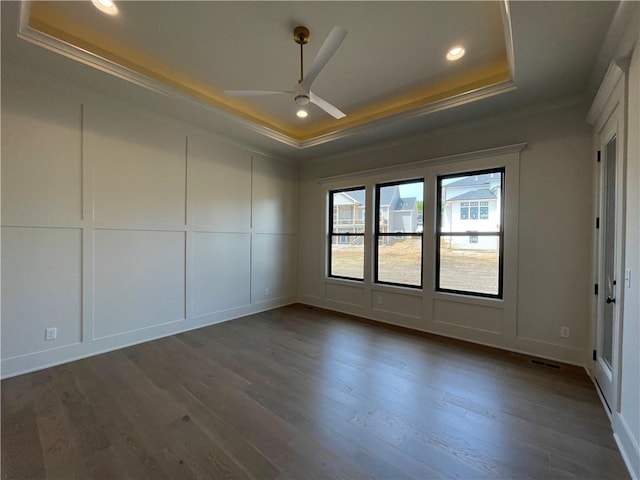 17000 Rosehill St, Overland Park, KS 66221 - spare room featuring a raised ceiling, ornamental molding, dark wood-style flooring, recessed lighting, and a ceiling fan