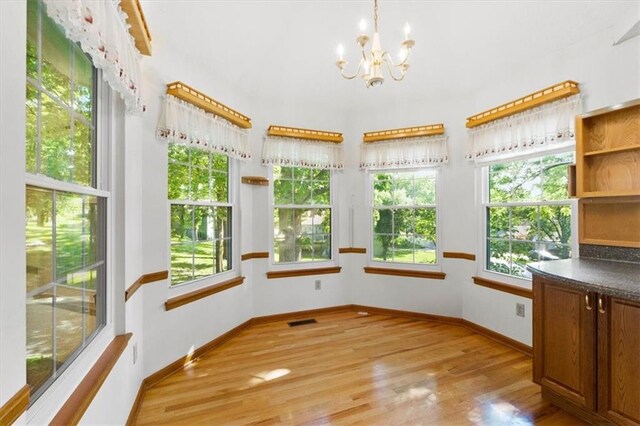 3000 Cedar Crest Dr, Independence, MO 64057 - unfurnished sunroom with a chandelier