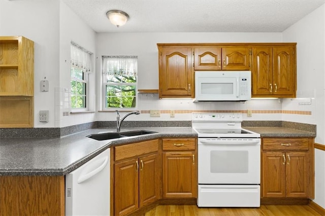 3000 Cedar Crest Dr, Independence, MO 64057 - kitchen featuring white appliances, open shelves, dark countertops, and a textured ceiling