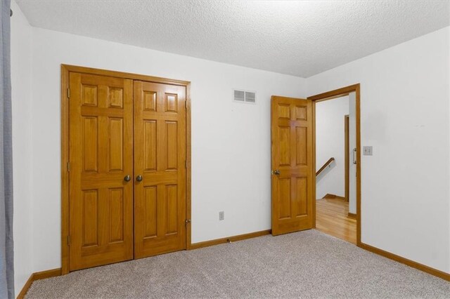 3000 Cedar Crest Dr, Independence, MO 64057 - bedroom with baseboards, carpet floors, and a textured ceiling
