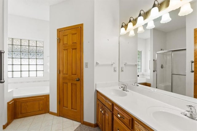 3000 Cedar Crest Dr, Independence, MO 64057 - bathroom with a stall shower, a garden tub, double vanity, and tile patterned flooring