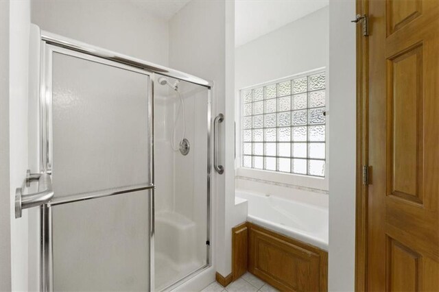 3000 Cedar Crest Dr, Independence, MO 64057 - full bathroom featuring a shower stall, a garden tub, and tile patterned flooring