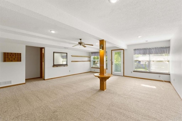 3000 Cedar Crest Dr, Independence, MO 64057 - unfurnished living room with a textured ceiling, carpet flooring, baseboards, ceiling fan, and recessed lighting
